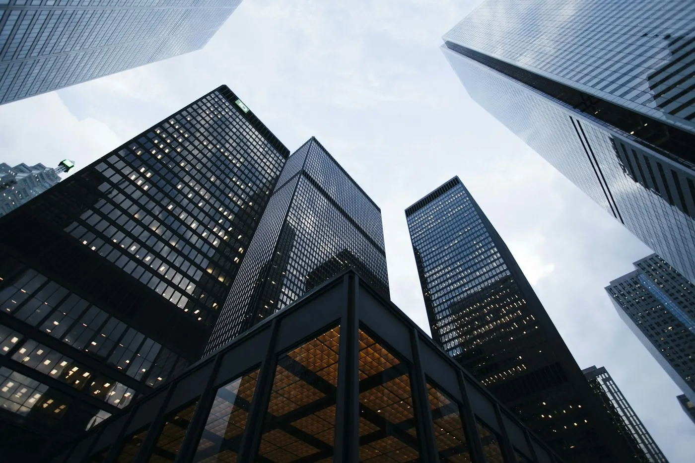 Looking up through a dense grid of commercial buildings